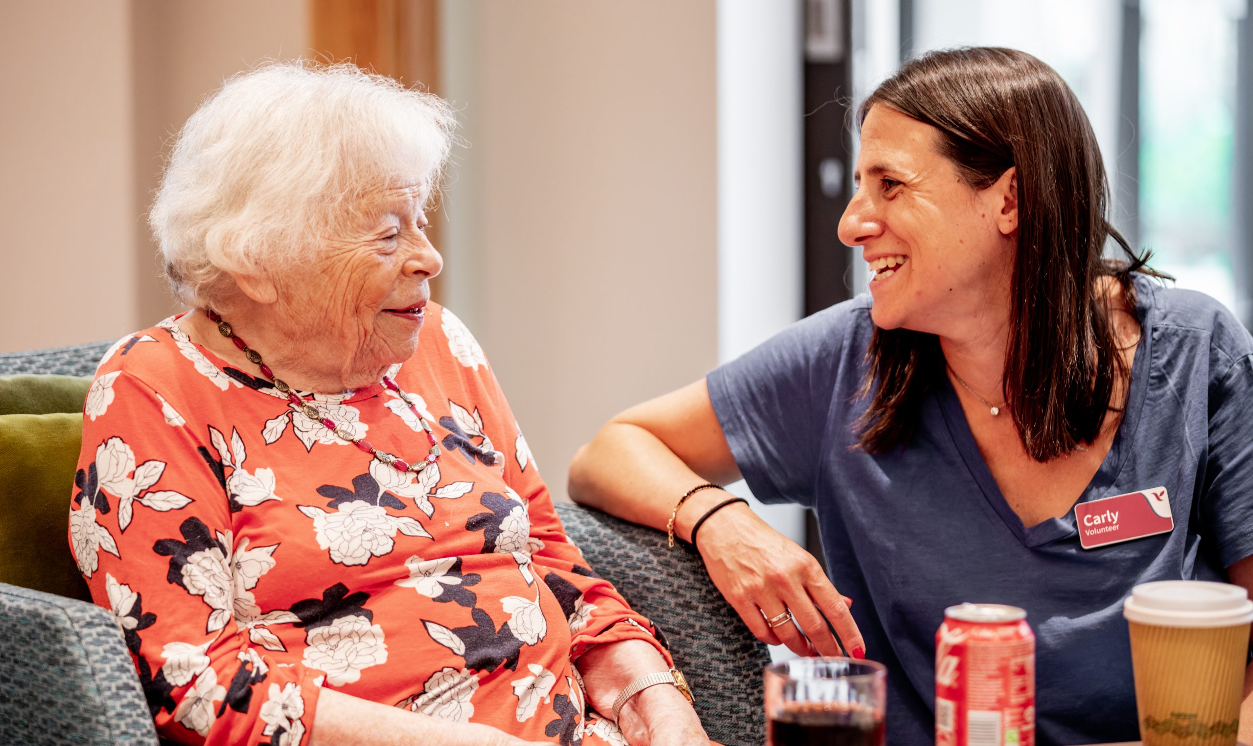 Volunteer talking to resident at Nightingale Hammerson