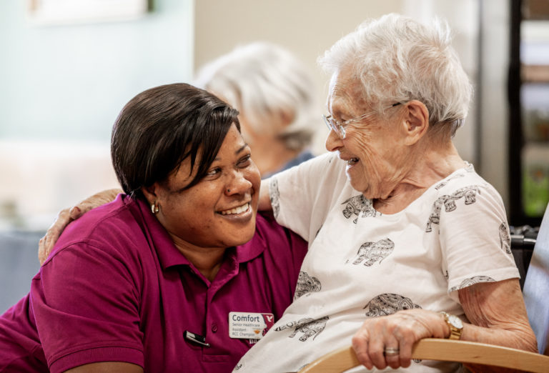 Nightingale Hammerson care worker engaging with resident